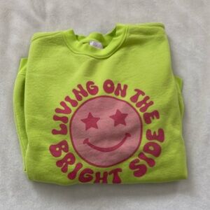 Oversized women’s sweatshirt size medium “living on the bright side”